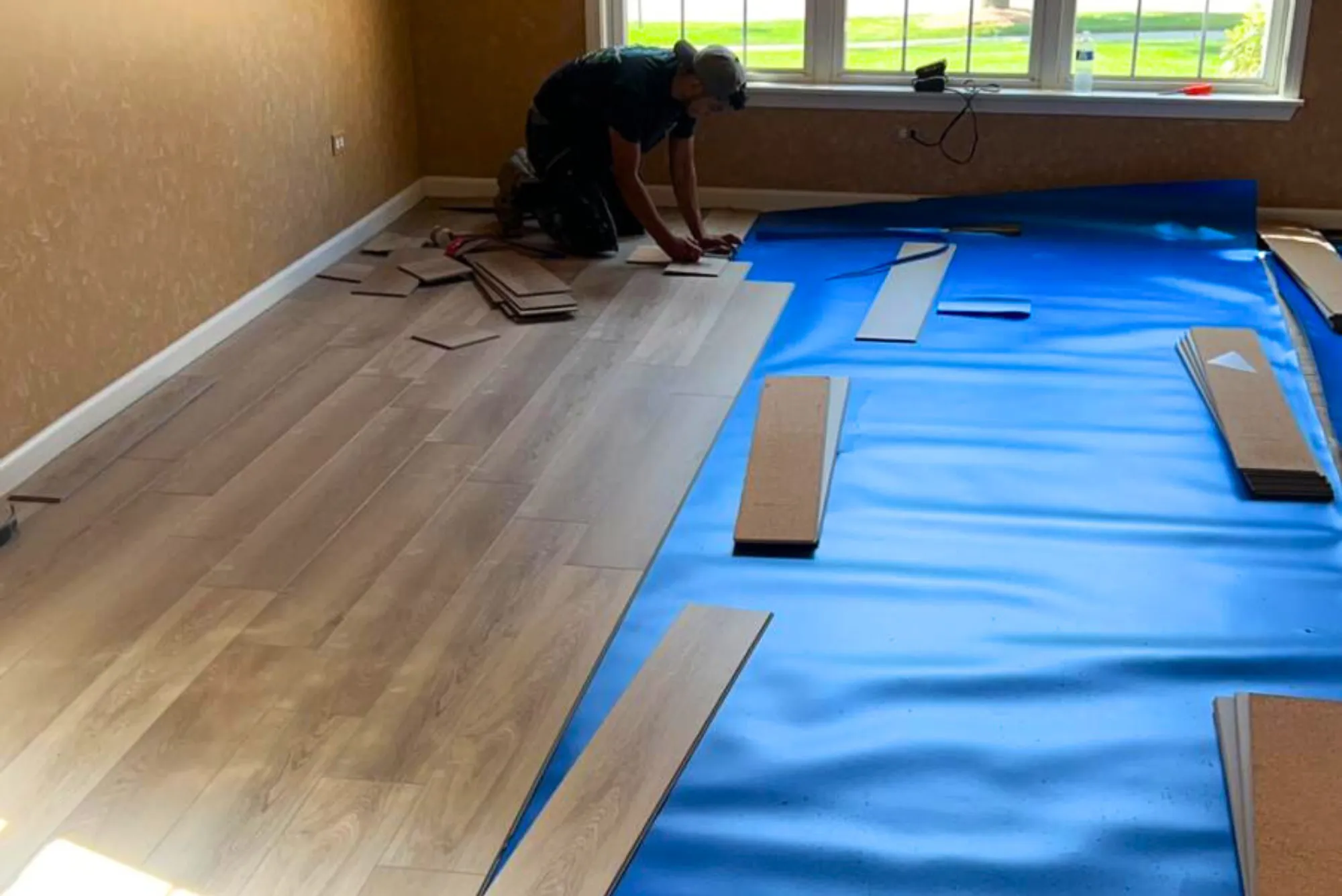 Expert team installing vinyl flooring with precision and attention to detail.