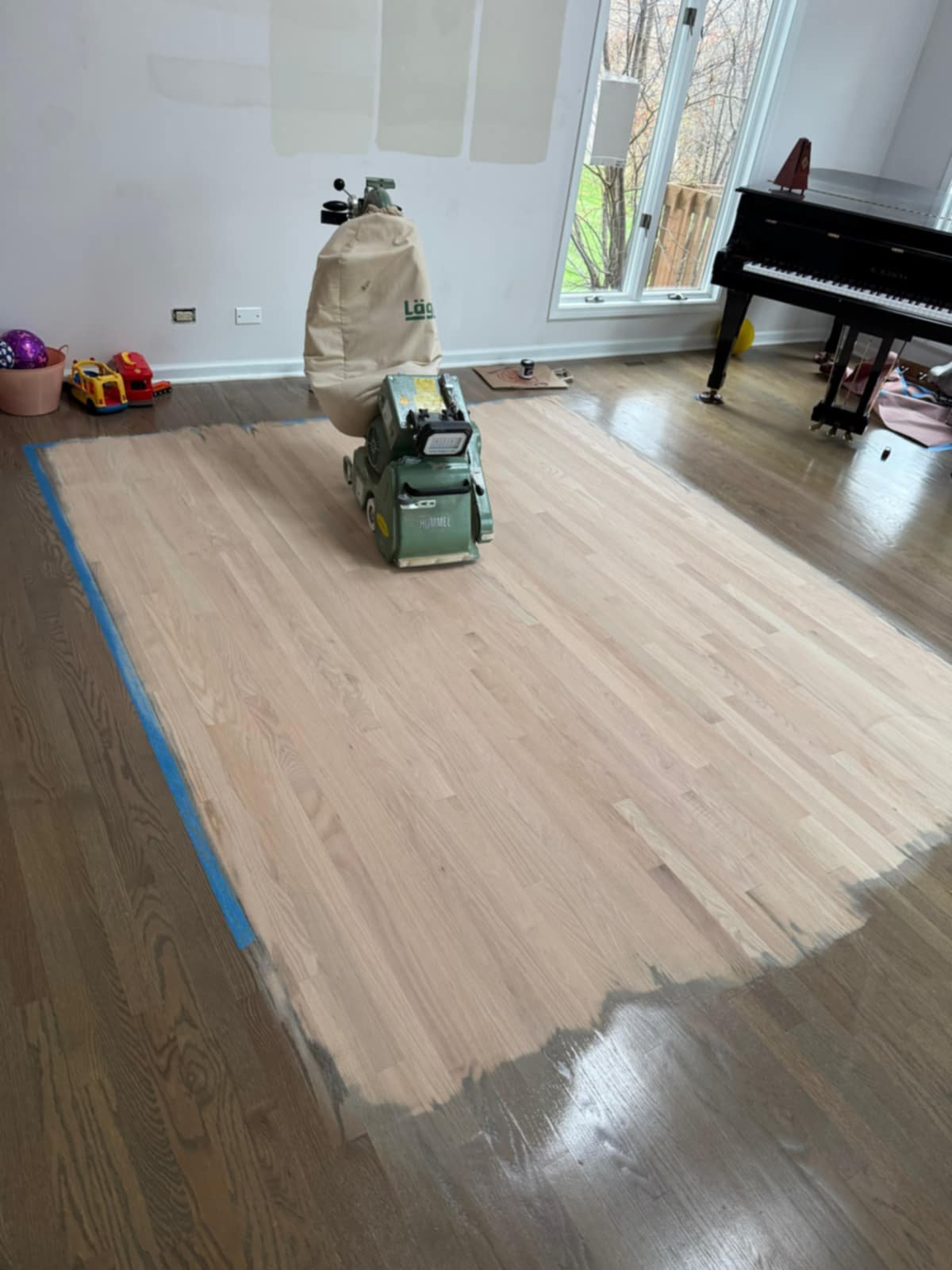 Hardwood floor refinishing in Barrington IL with professional dustless sanding in a living room