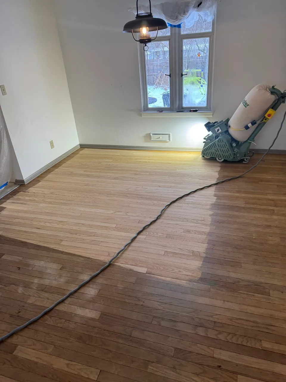 Wood floor restoration and staircase refinishing in Rockford, IL by Ramos Wood Floors