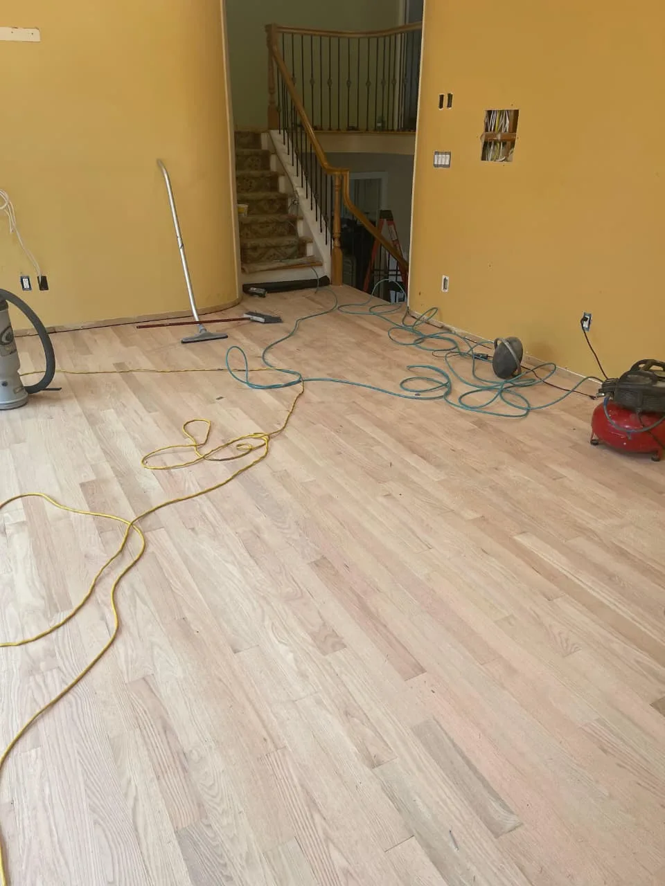 Finished hardwood floor installation in a Rockford home — oak natural stain