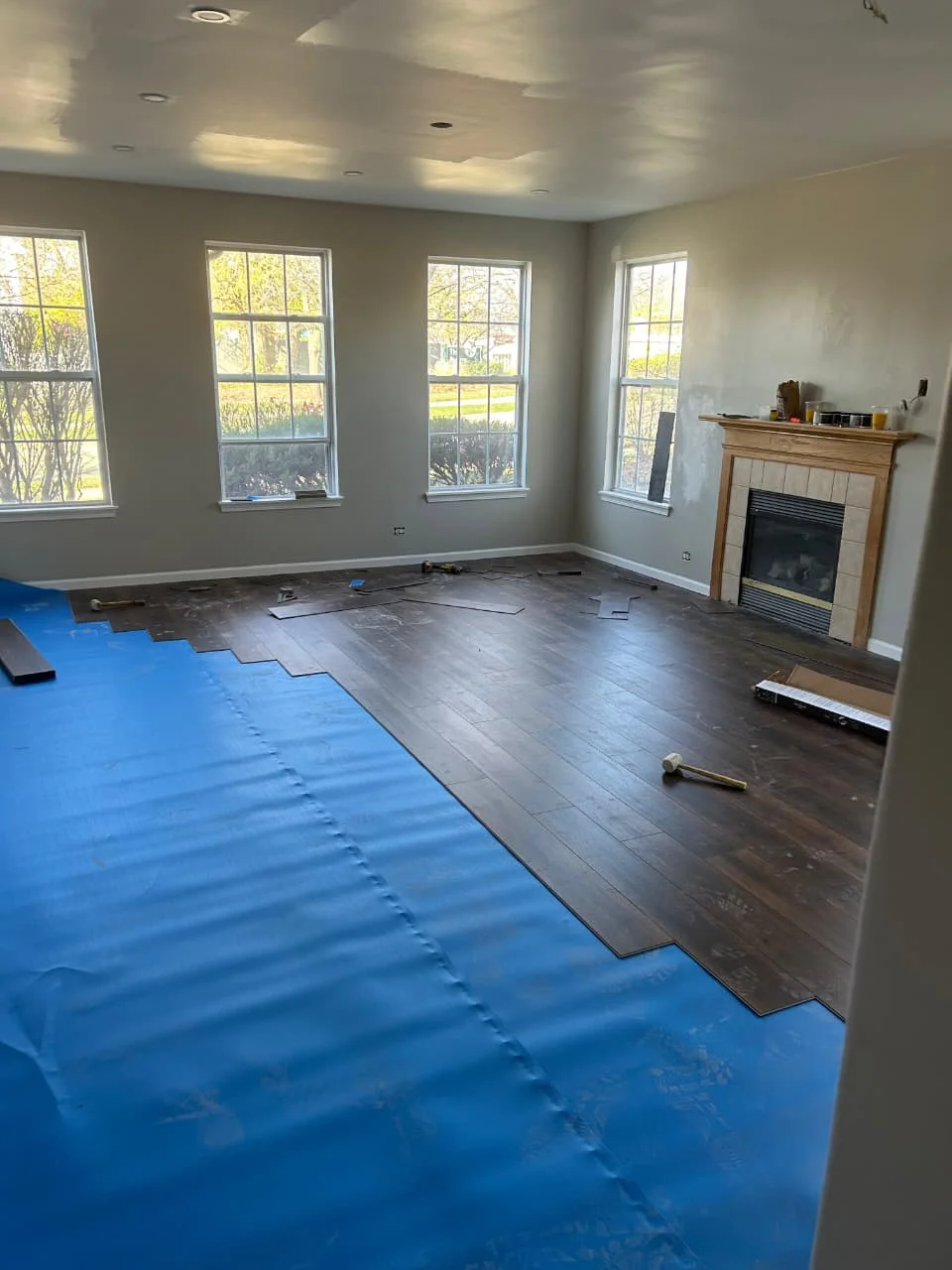 Wide plank laminate installed in a Rockford, IL bedroom