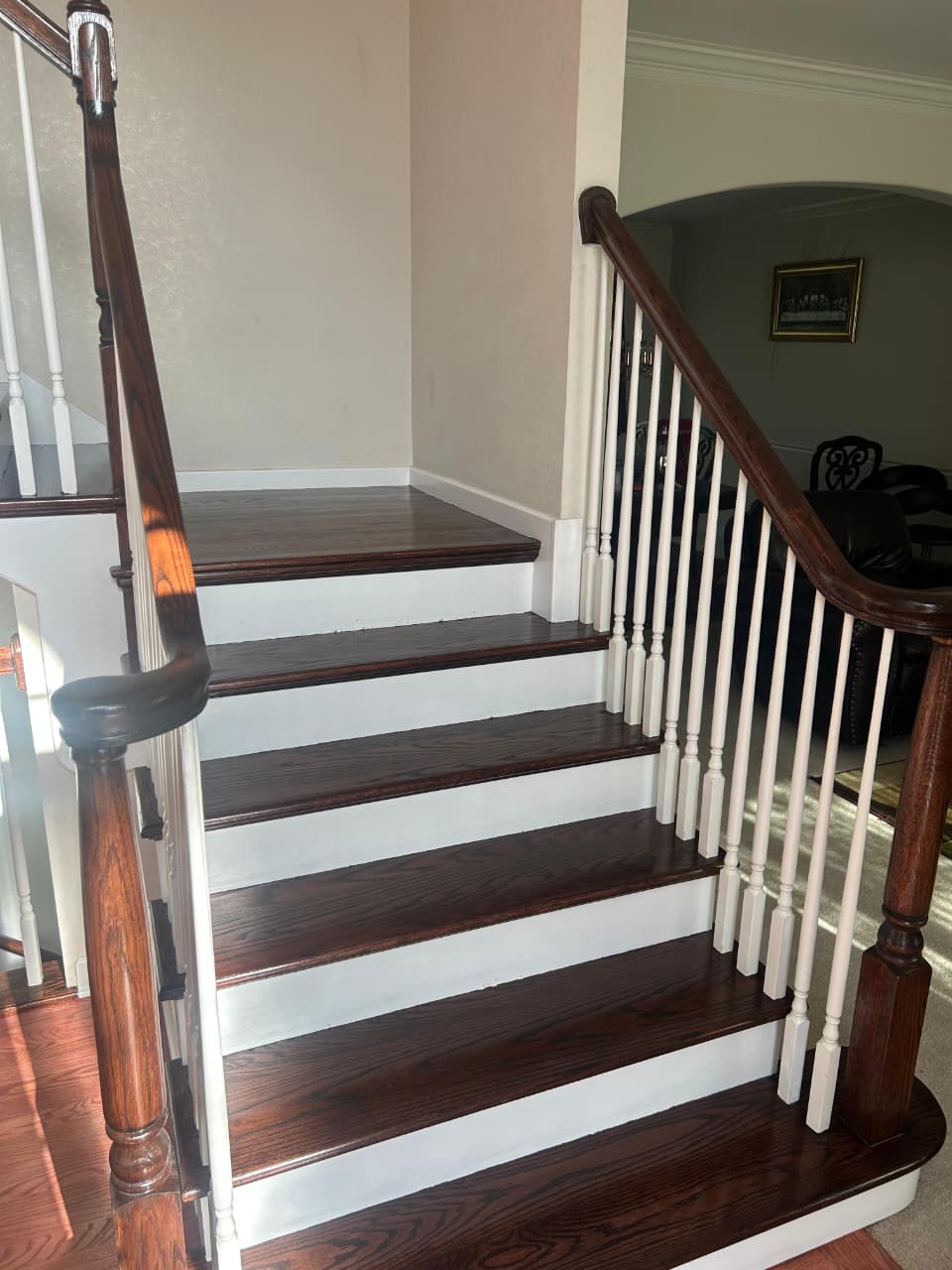 Staircase flooring installation — matching main floor wood