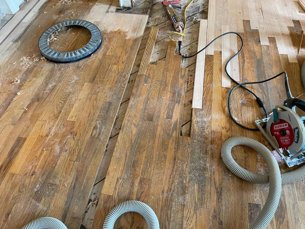 Hardwood floor restored after pet urine damage — stain matched and refinished