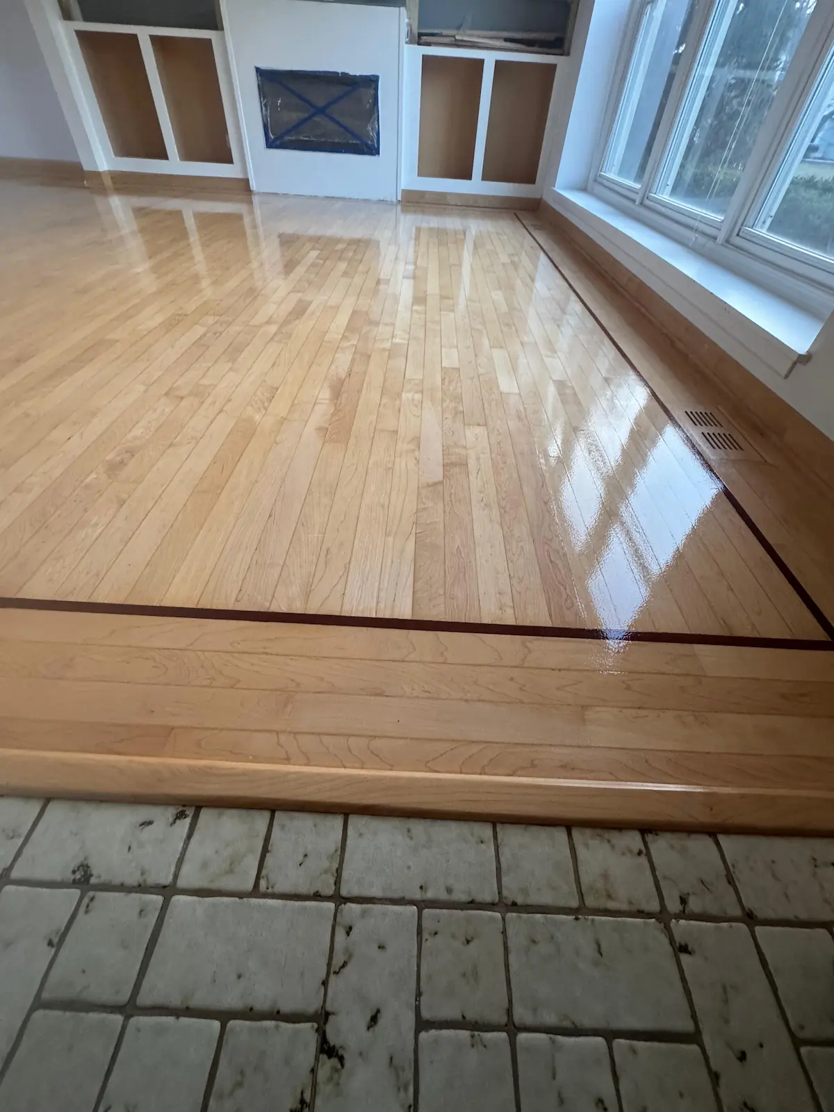 Hardwood floor refinishing in Rockford, IL — dustless sanding and Bona Traffic HD finish