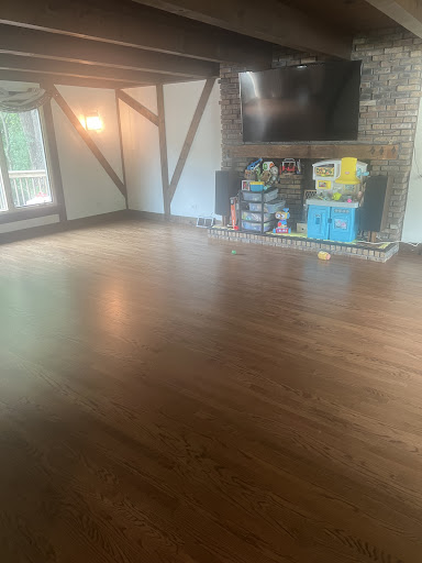 Refinished red oak hardwood flooring in living room